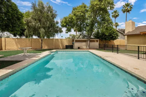 a view of a backyard with a small pool