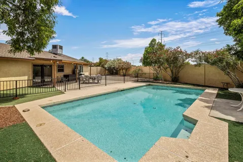 a view of a backyard with sitting area