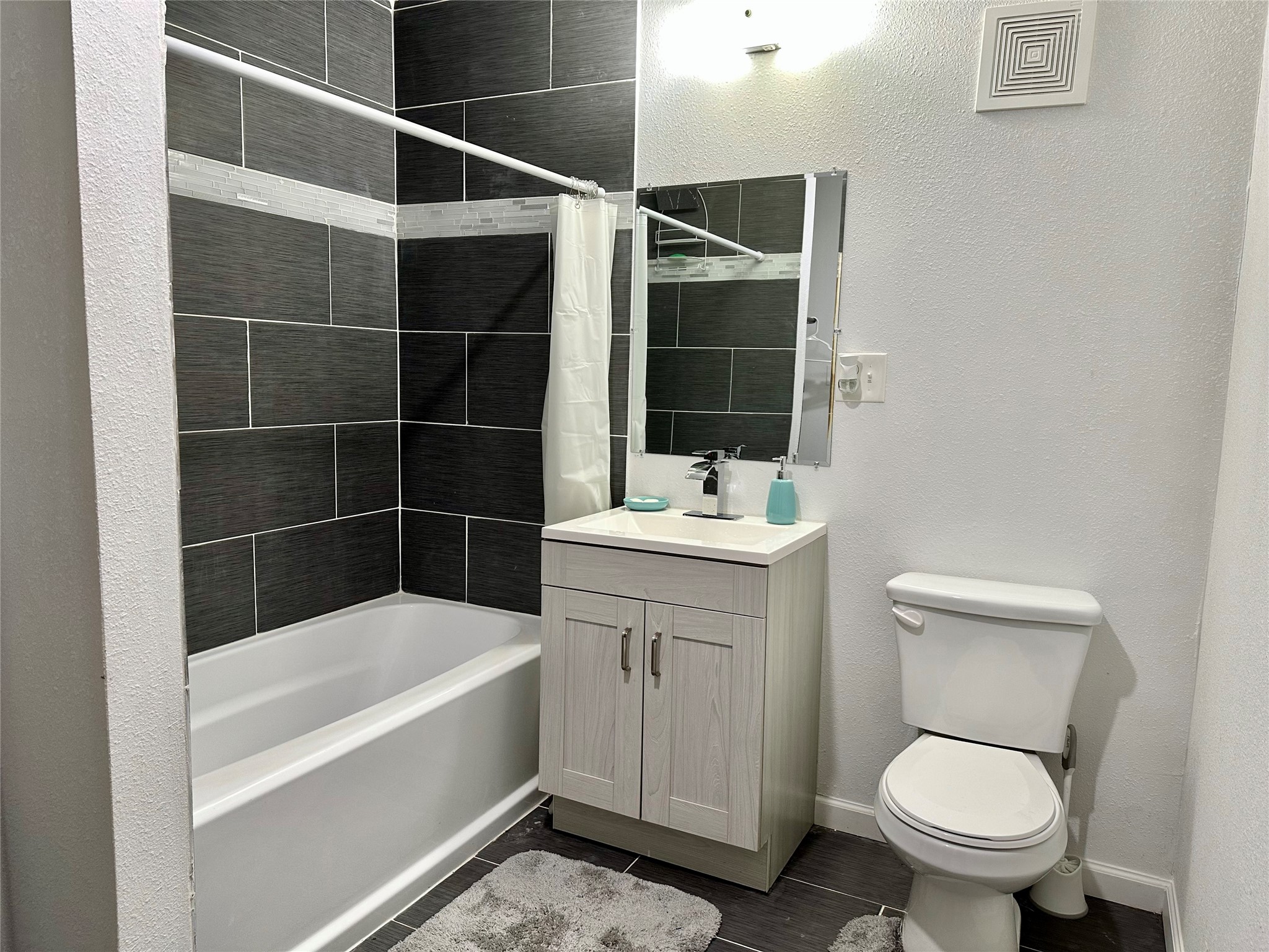 4802 Elser Street Houston, TX 77009 - Photo 15 of 21 a bathroom with a sink a toilet and shower