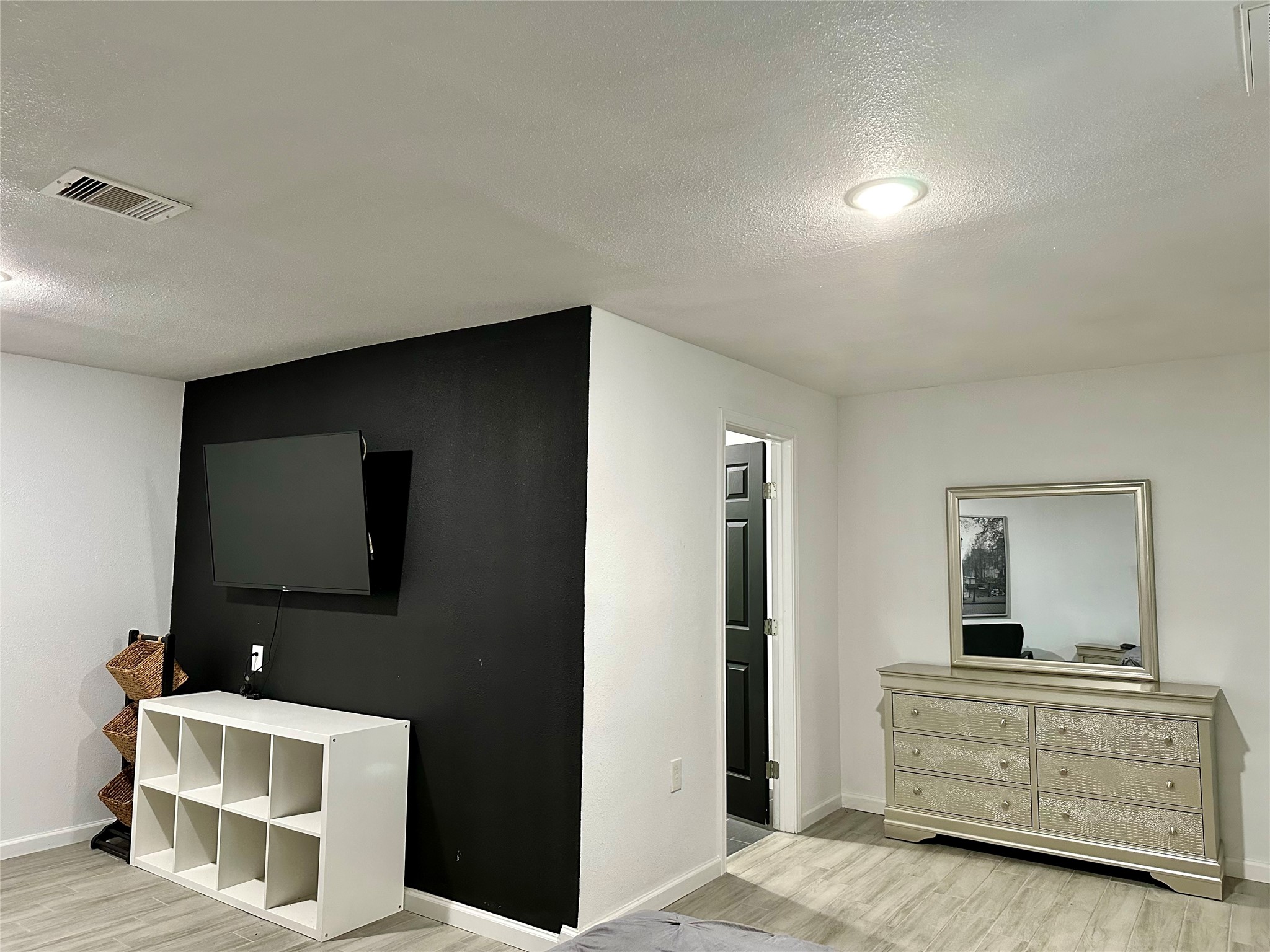 4802 Elser Street Houston, TX 77009 - Photo 4 of 21 a living room with furniture and a flat screen tv