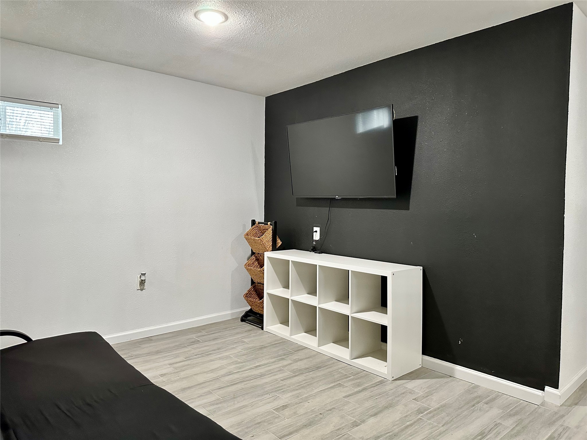 4802 Elser Street Houston, TX 77009 - Photo 5 of 21 a view of a livingroom with wooden floor and cabinet