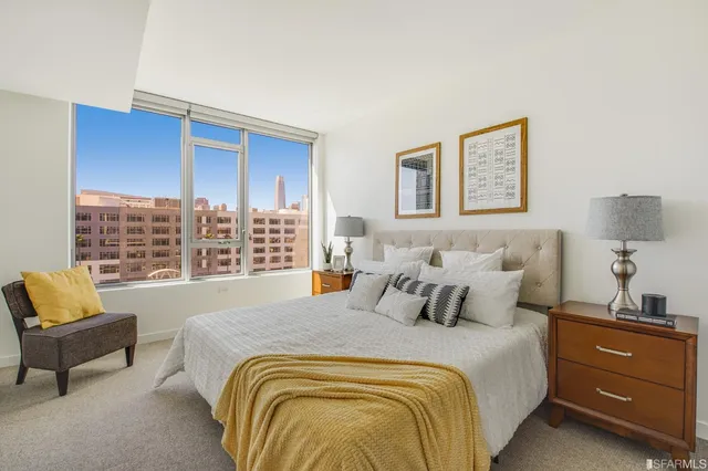 a bedroom with a bed and a couch