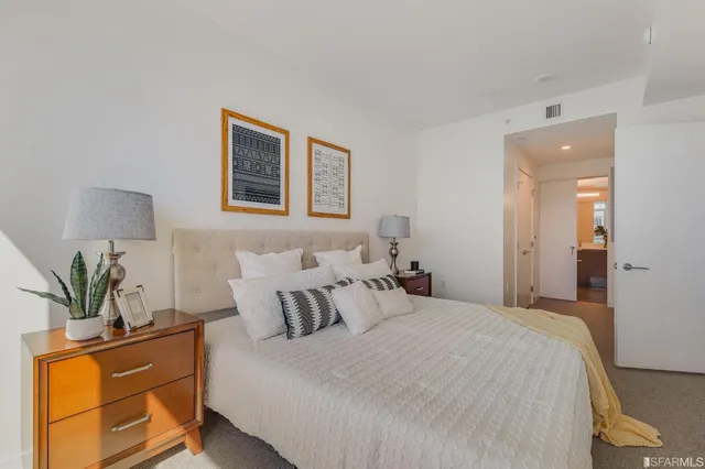 a bedroom with bed and window