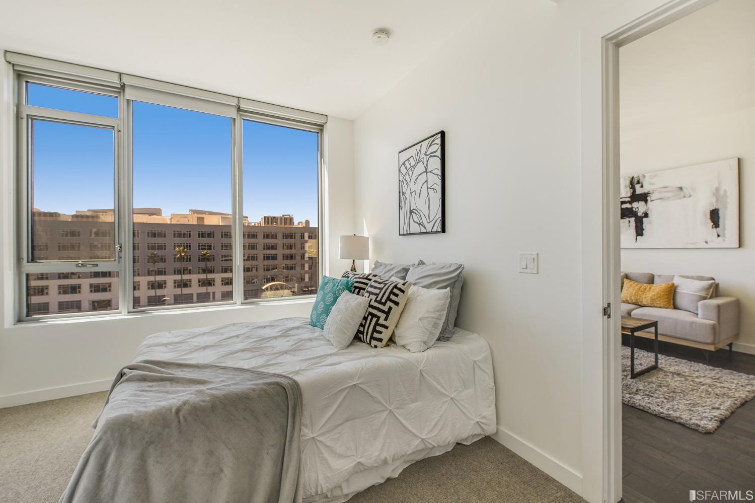 1000 3rd Street, Unit 605 San Francisco, CA 94158 - Photo 16 of 36 a bedroom with a bed and a window