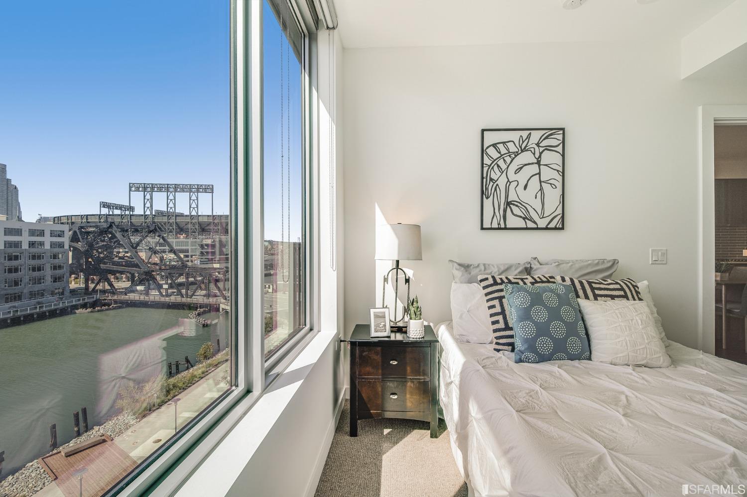 1000 3rd Street, Unit 605 San Francisco, CA 94158 - Photo 19 of 36 a bedroom with a bed and a view of balcony