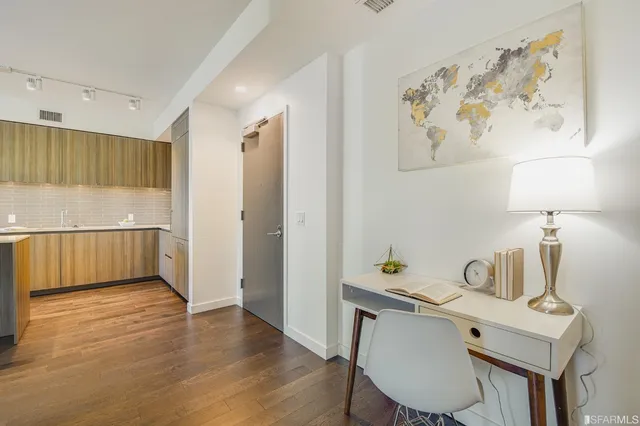 a workspace with furniture and wooden floor