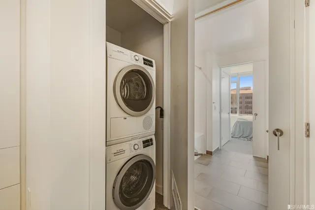 a view of a hallway with washer and dryer