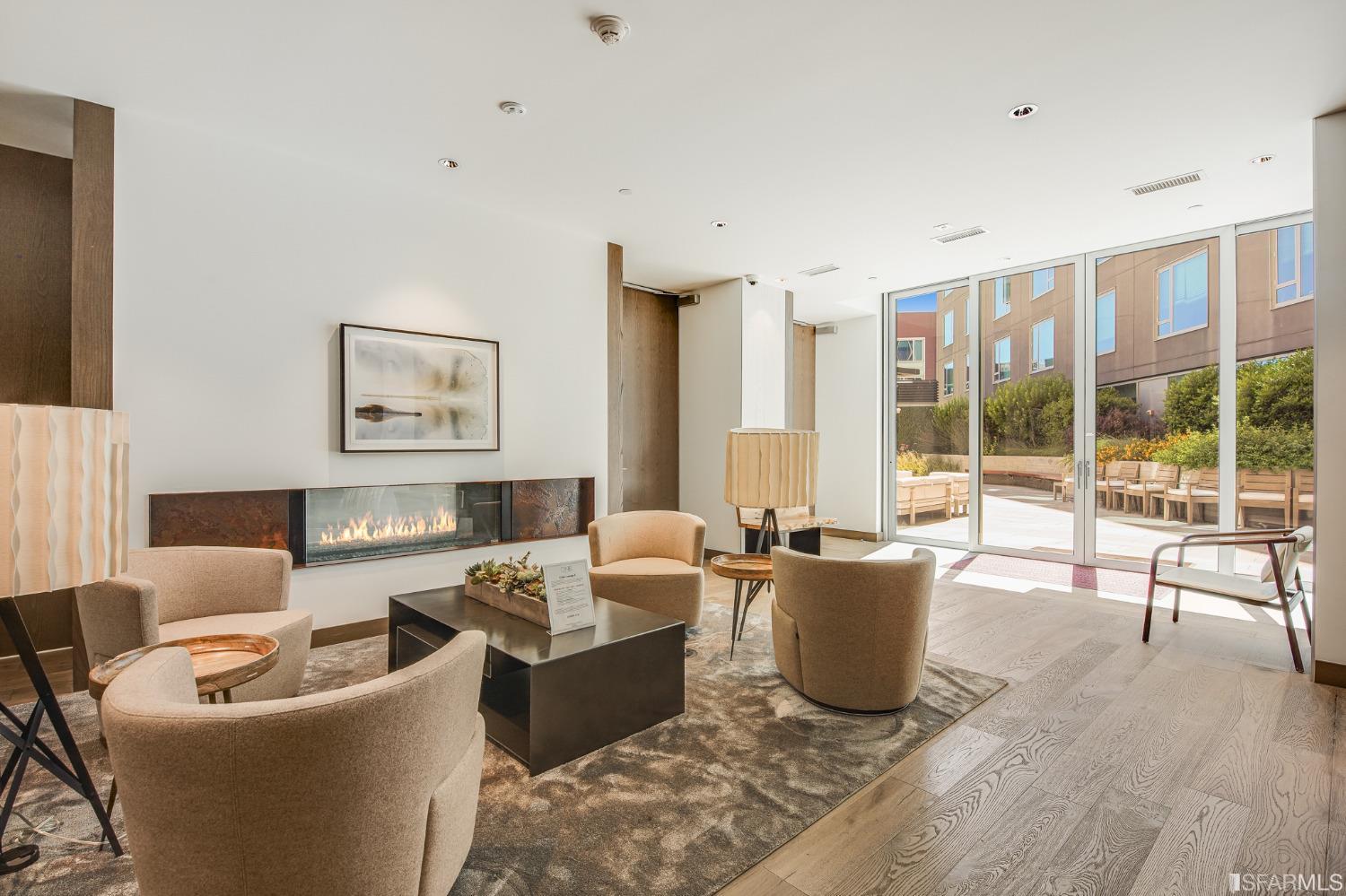 1000 3rd Street, Unit 605 San Francisco, CA 94158 - Photo 22 of 36 a living room with furniture a large window and wooden floor