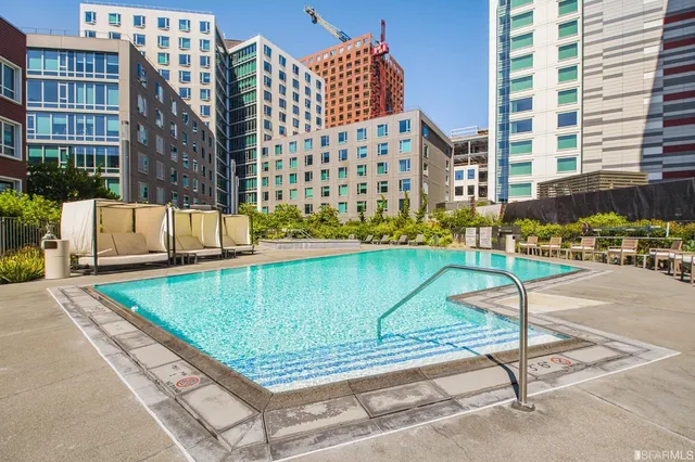 a view of a swimming pool with a lounge chairs