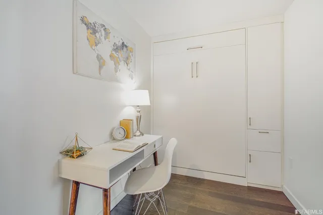 a view of a workspace with furniture