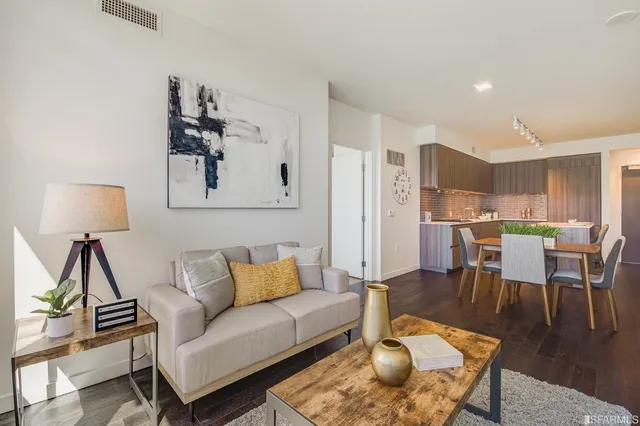 a living room with furniture and a lamp