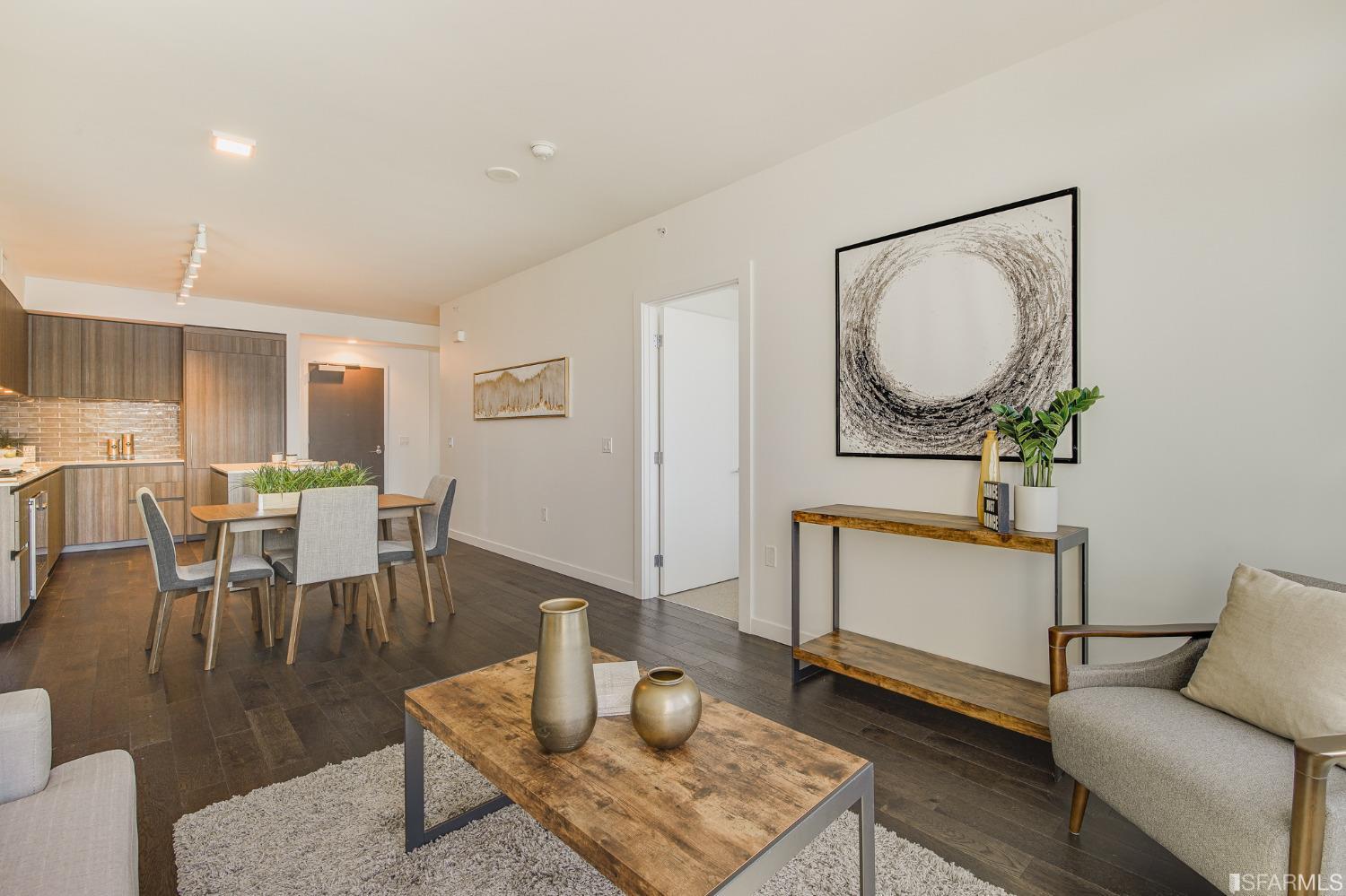 1000 3rd Street, Unit 605 San Francisco, CA 94158 - Photo 5 of 36 a living room with furniture a mirror and a table