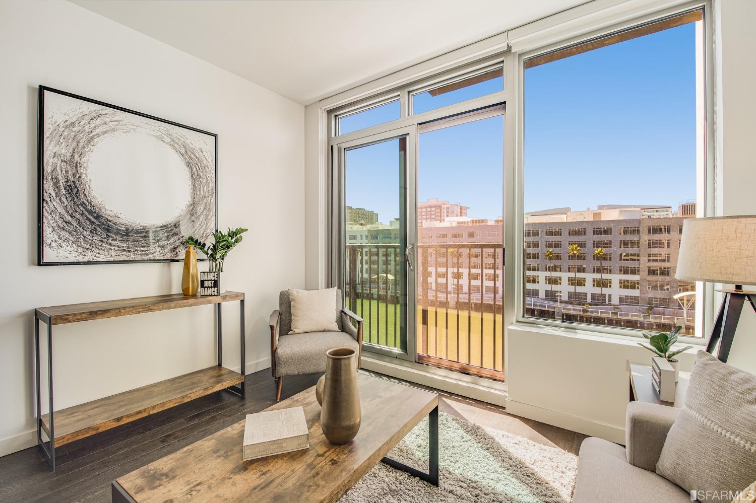 1000 3rd Street, Unit 605 San Francisco, CA 94158 - Photo 6 of 36 a living room with furniture and a large window