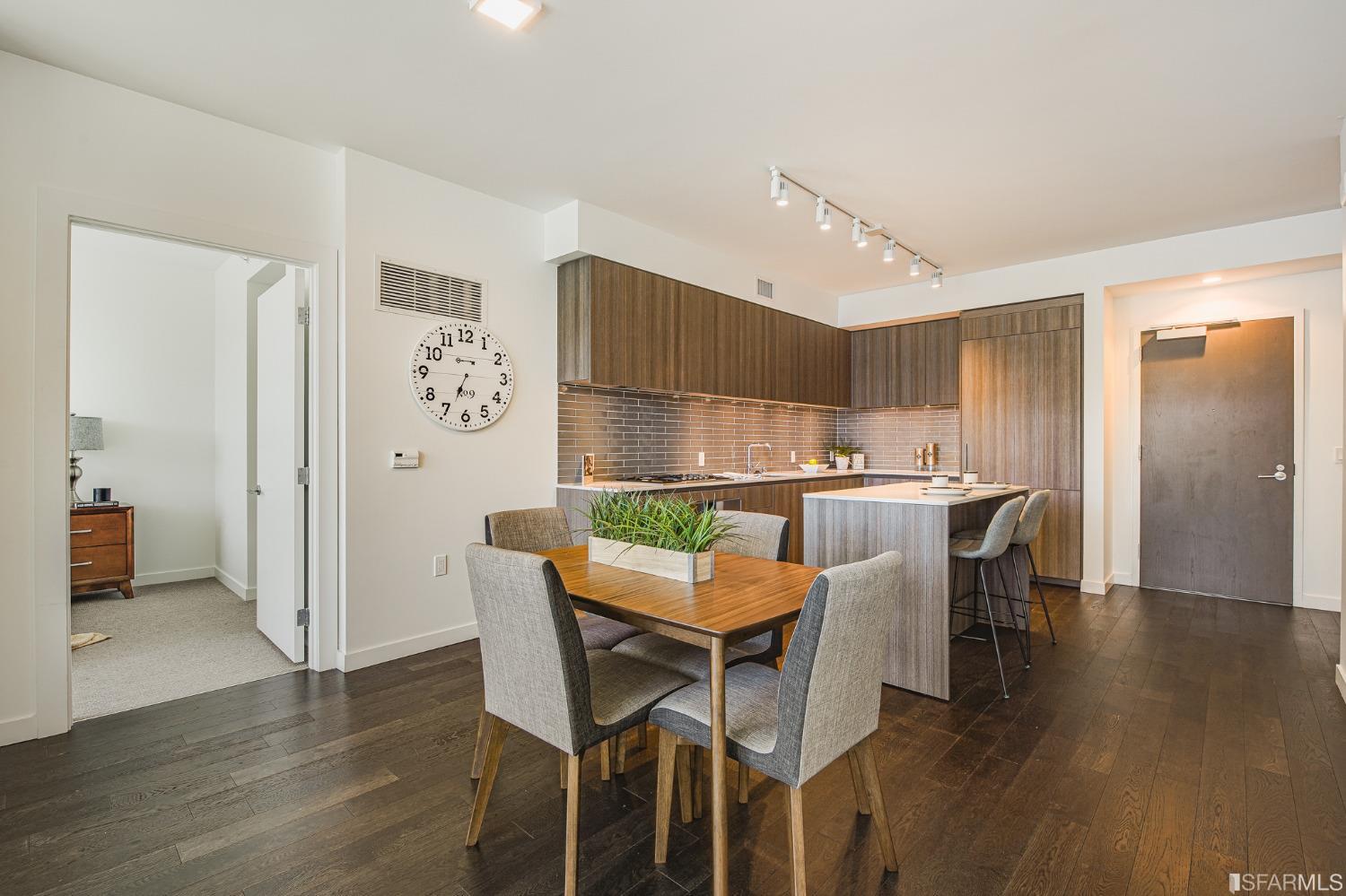 1000 3rd Street, Unit 605 San Francisco, CA 94158 - Photo 9 of 36 a dining room with furniture and wooden floor