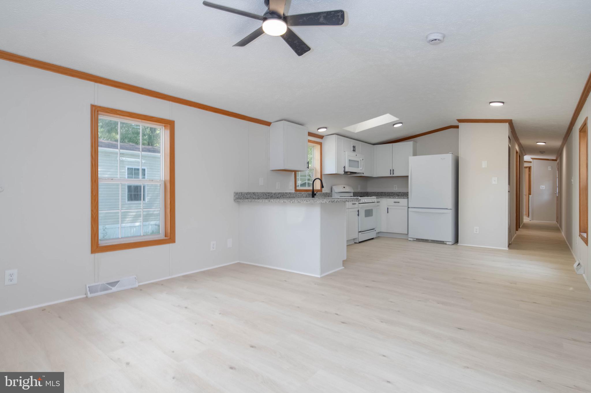11540 Philadelphia Road White Marsh, MD 21162 - Photo 15 of 32 a view of a kitchen with a sink cabinets and a window