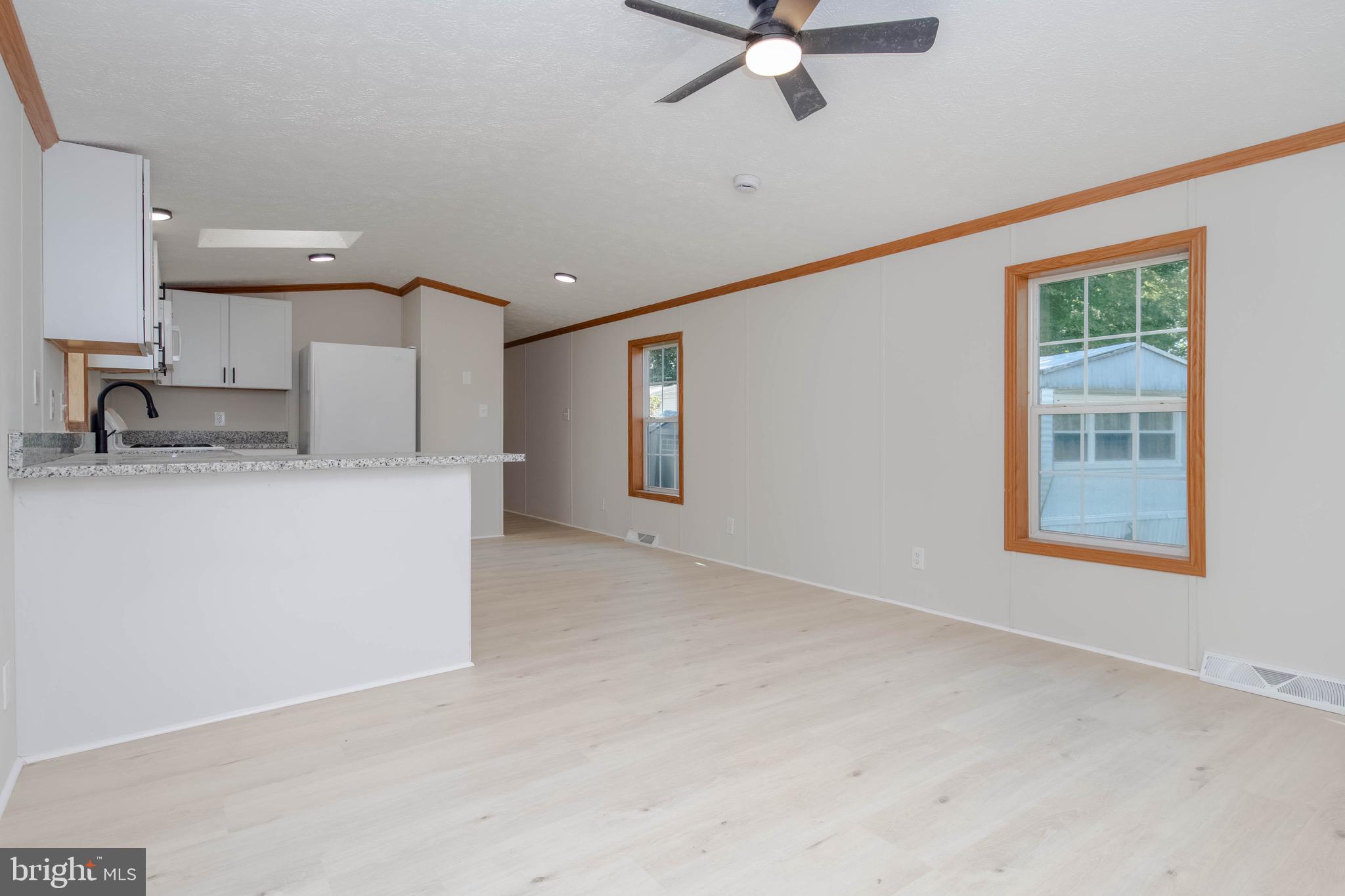 11540 Philadelphia Road White Marsh, MD 21162 - Photo 16 of 32 a view of a kitchen with a sink and a window