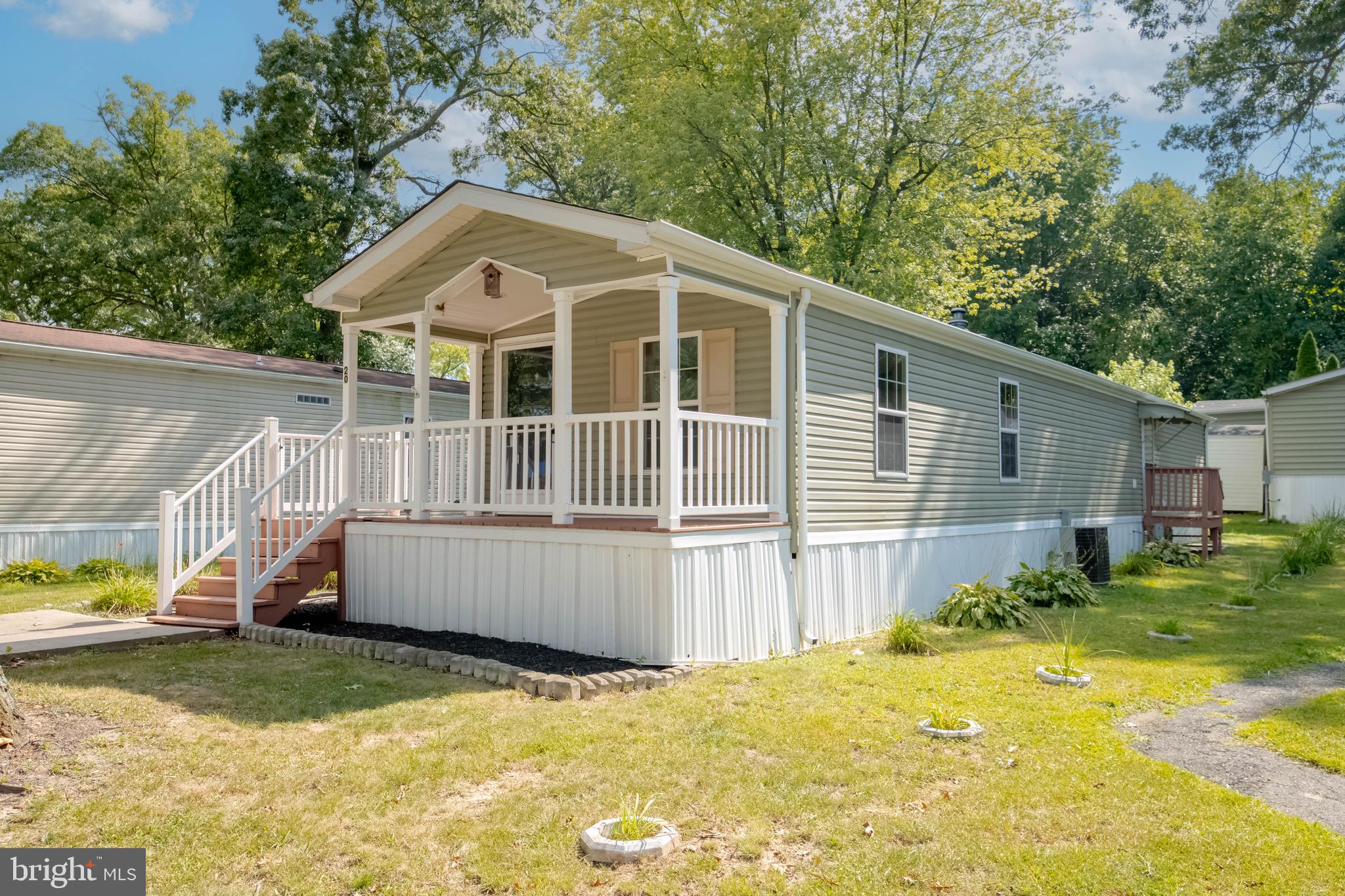 11540 Philadelphia Road White Marsh, MD 21162 - Photo 2 of 32 a front view of house with yard and trees in the background