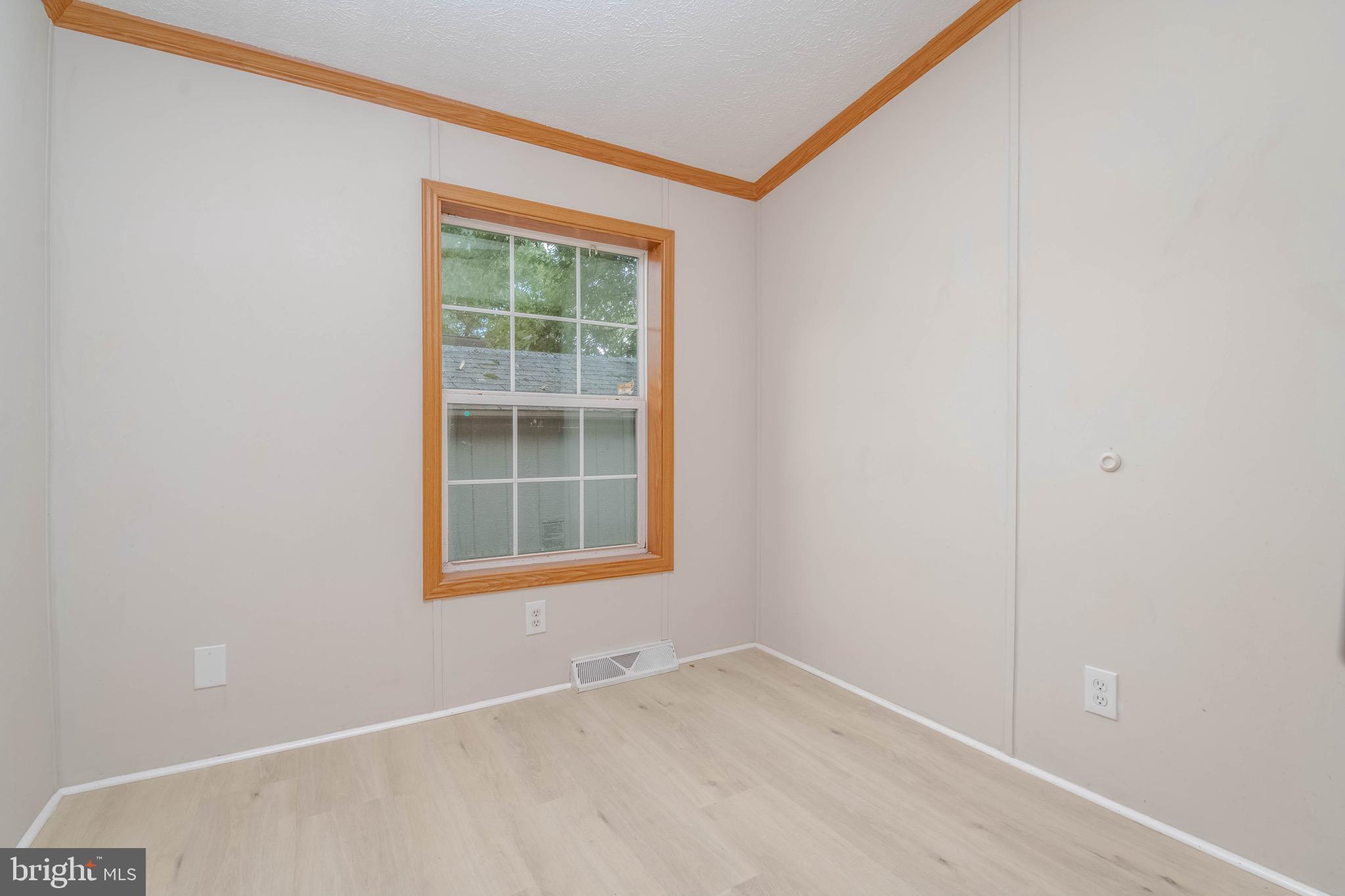 11540 Philadelphia Road White Marsh, MD 21162 - Photo 23 of 32 a view of an empty room with a window