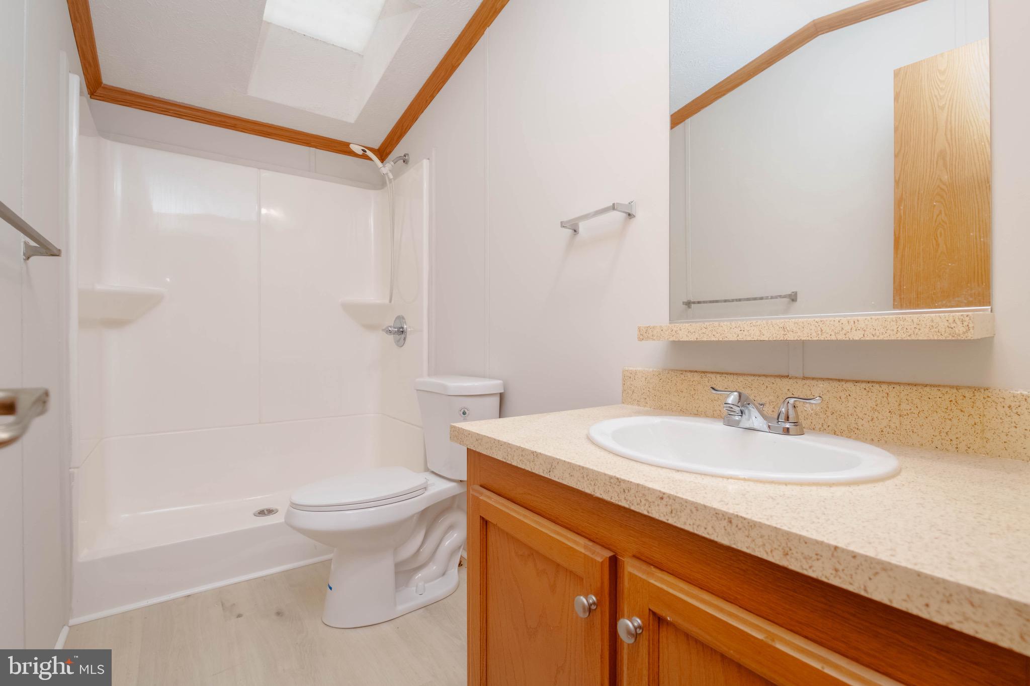 11540 Philadelphia Road White Marsh, MD 21162 - Photo 30 of 32 a bathroom with a sink a toilet and shower