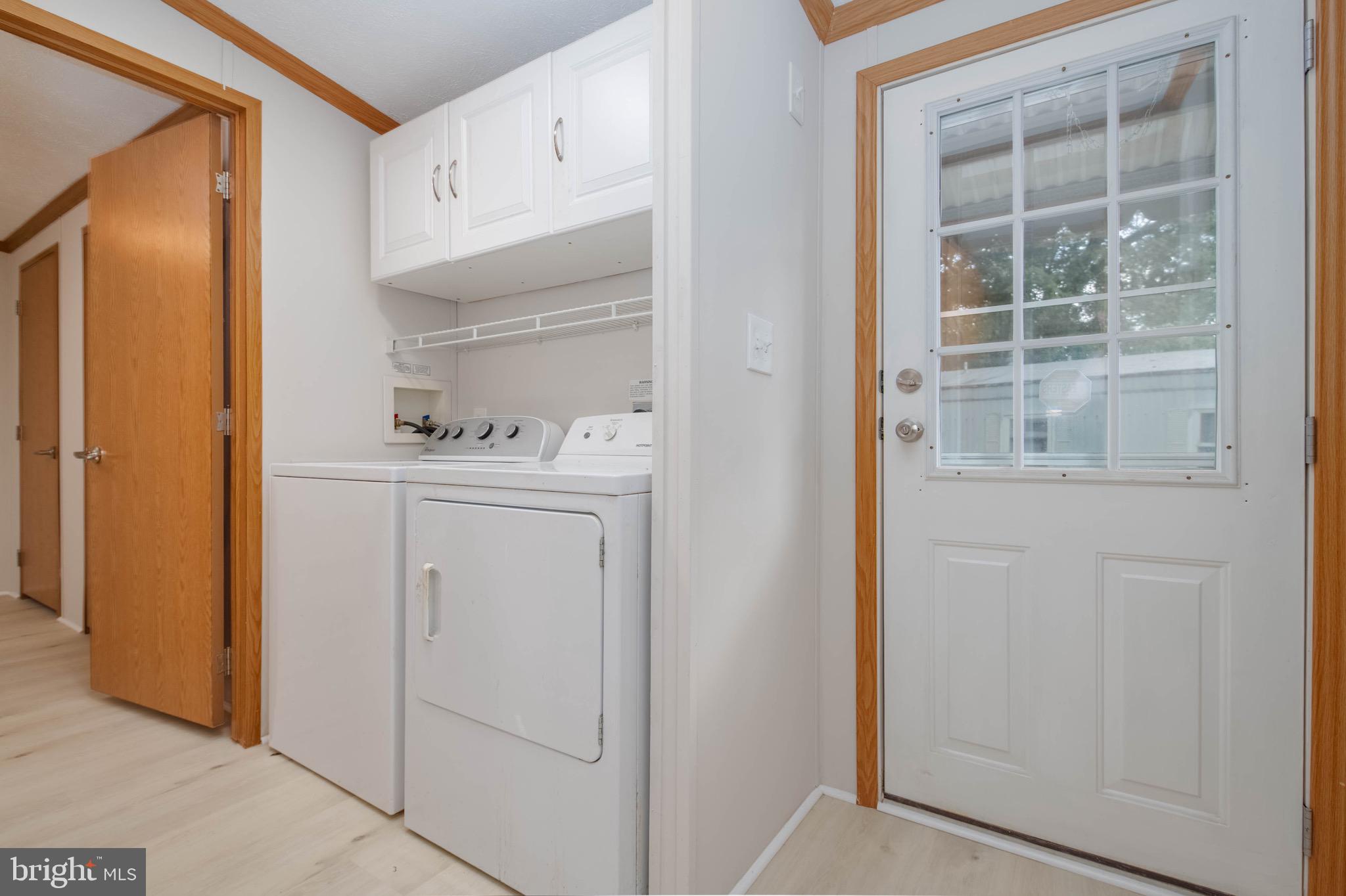 11540 Philadelphia Road White Marsh, MD 21162 - Photo 32 of 32 a utility room with cabinets washer and dryer
