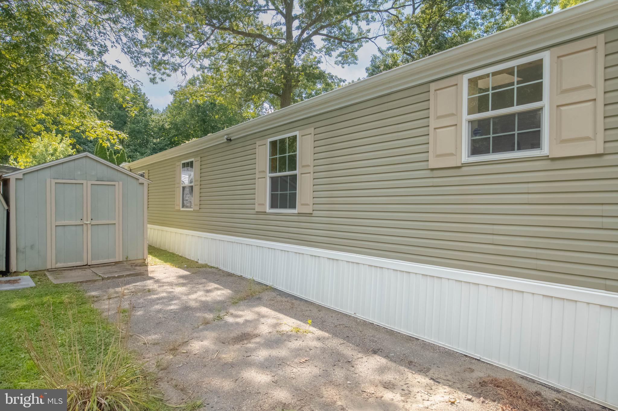 11540 Philadelphia Road White Marsh, MD 21162 - Photo 5 of 32 a view of a backyard with a large tree