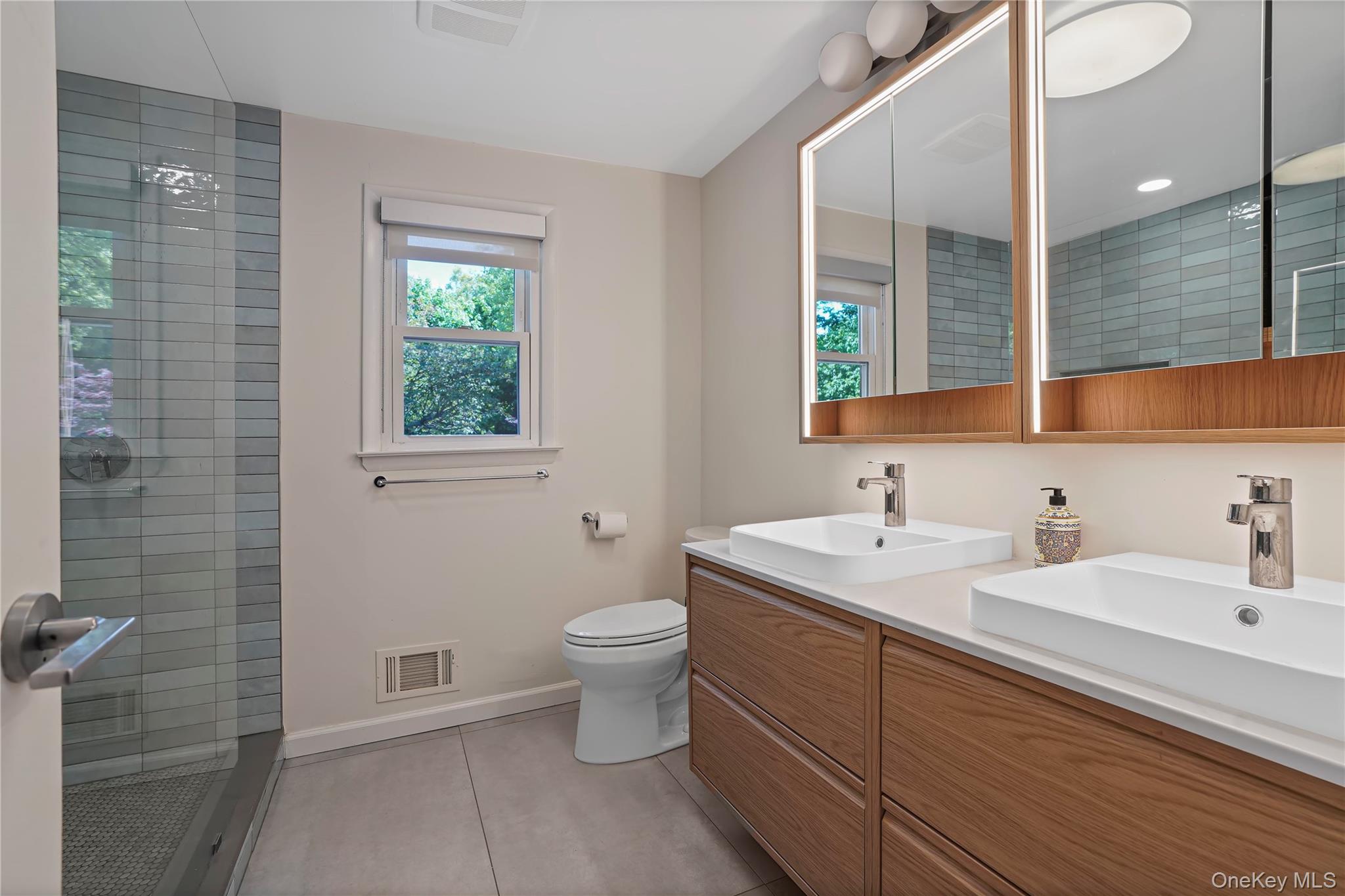 97 Hanson Lane New Rochelle, NY 10804 - Photo 29 of 43 En Suite Spa Bathroom With Double Sinks