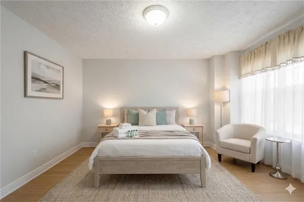 a bedroom with a bed and a couch