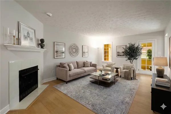a living room with furniture and a fireplace
