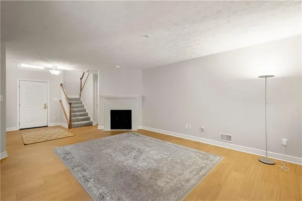 an empty room with a fireplace