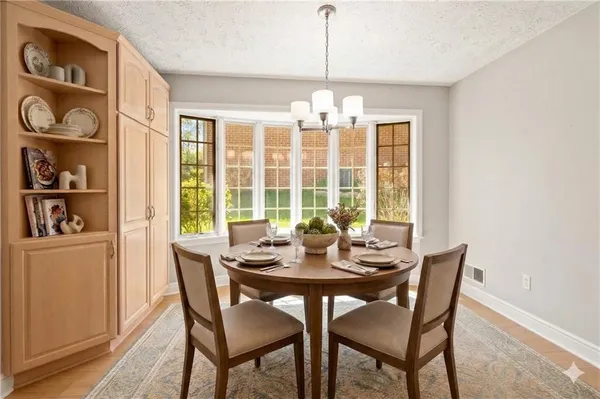 a view of a dining room with furniture window and outside view