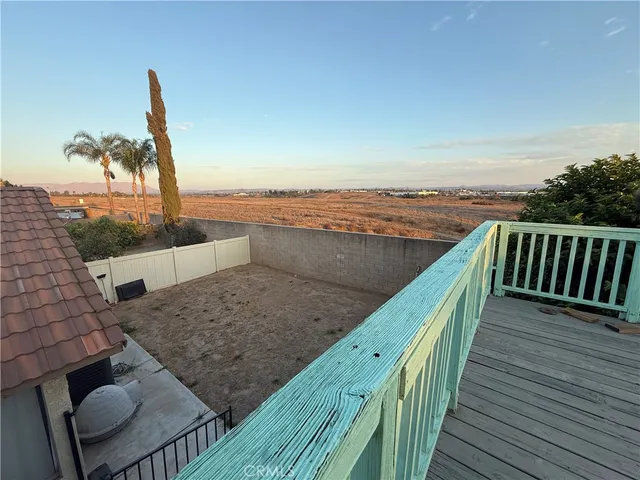 a view of a deck with a yard