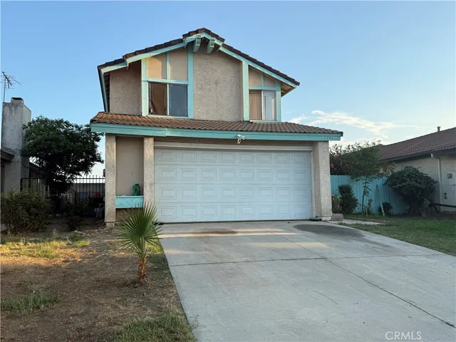 a front view of a house with a garage