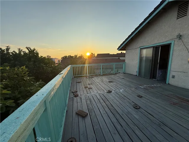 a view of balcony with wooden floor and city view