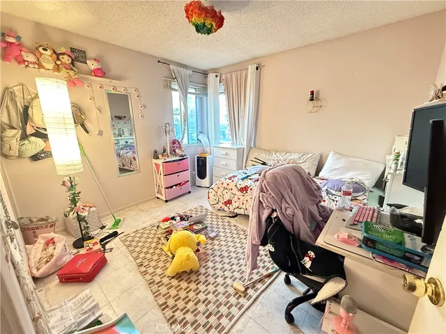 a bedroom with furniture and a bed