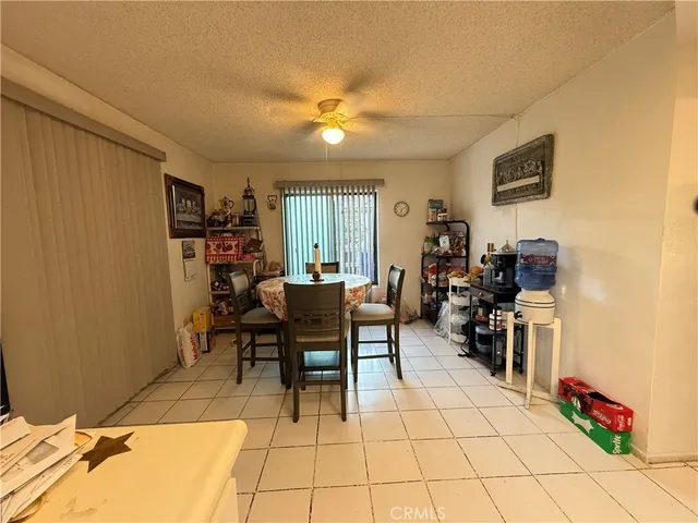 a view of a livingroom with furniture and a window