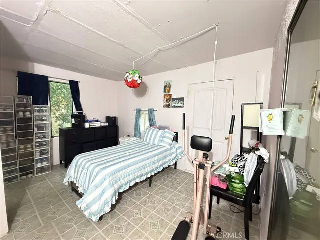a bedroom with a bed and a table