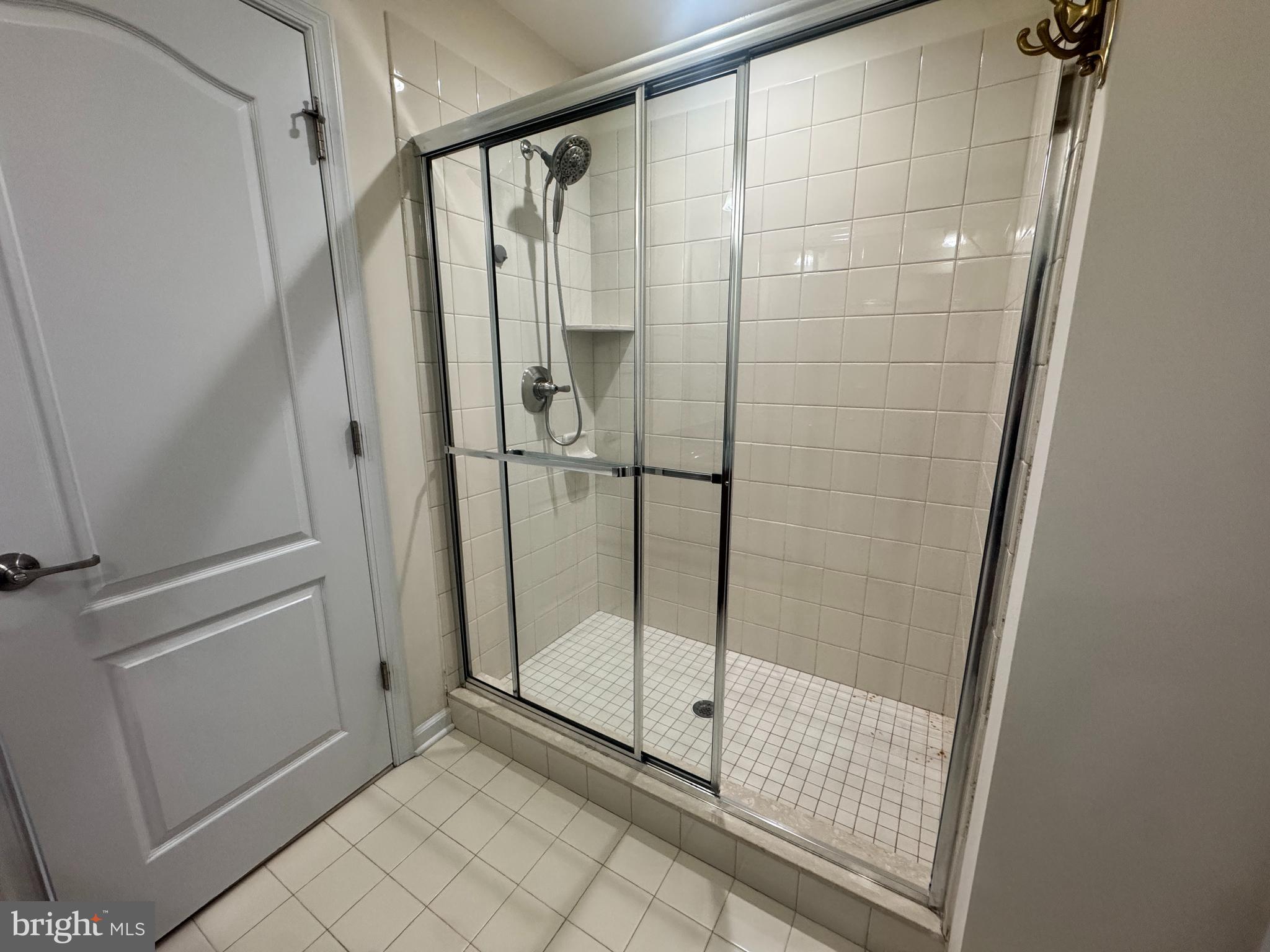 3313 Pietro Way Philadelphia, PA 19145 - Photo 5 of 16 a bathroom with a glass door shower
