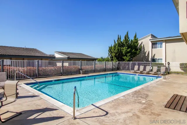 a view of a swimming pool with a lounge chairs