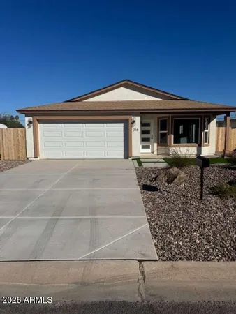 a front view of a house with yard