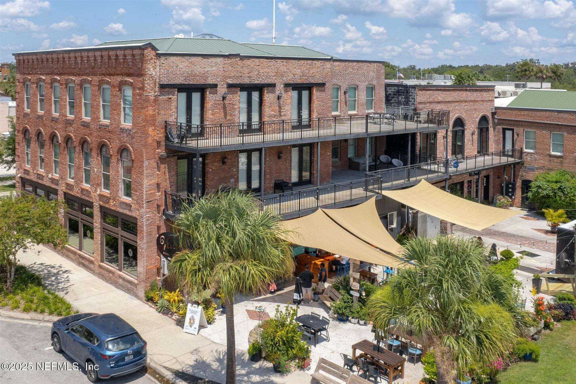 an aerial view of a house with swimming pool