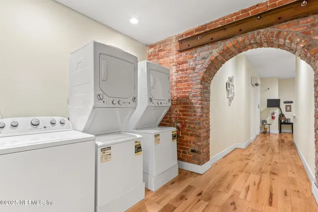 a bedroom with a bed and a ceiling fan