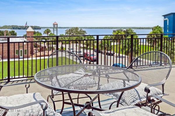 a view of roof deck with furniture