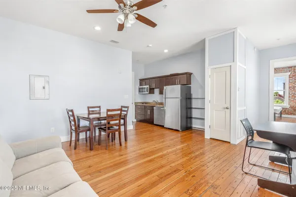 a view of a livingroom with furniture and wooden floor