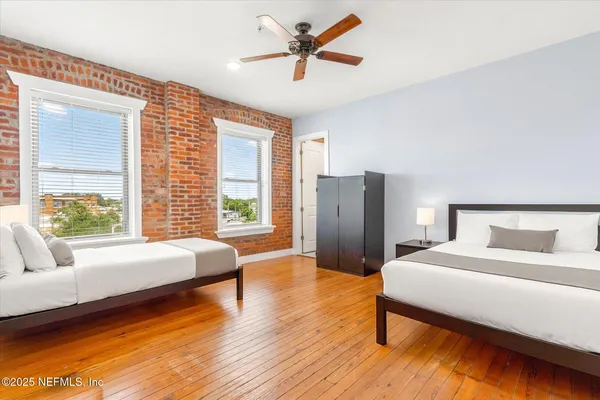 a spacious bedroom with a bed and a couch