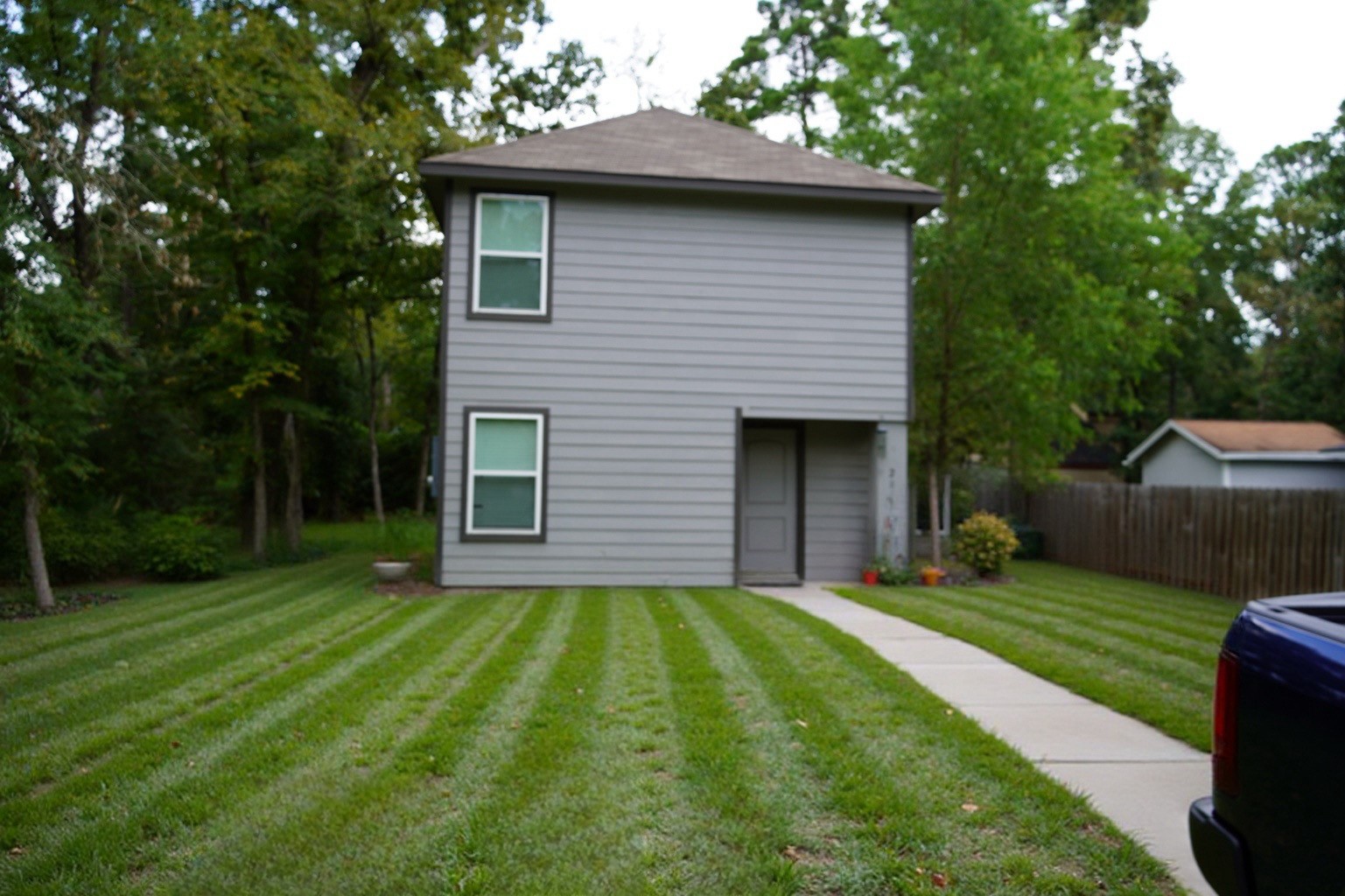 28612 Rantoul Court Point Blank, TX 77364 - Photo 1 of 4 a front view of a house with a yard and trees