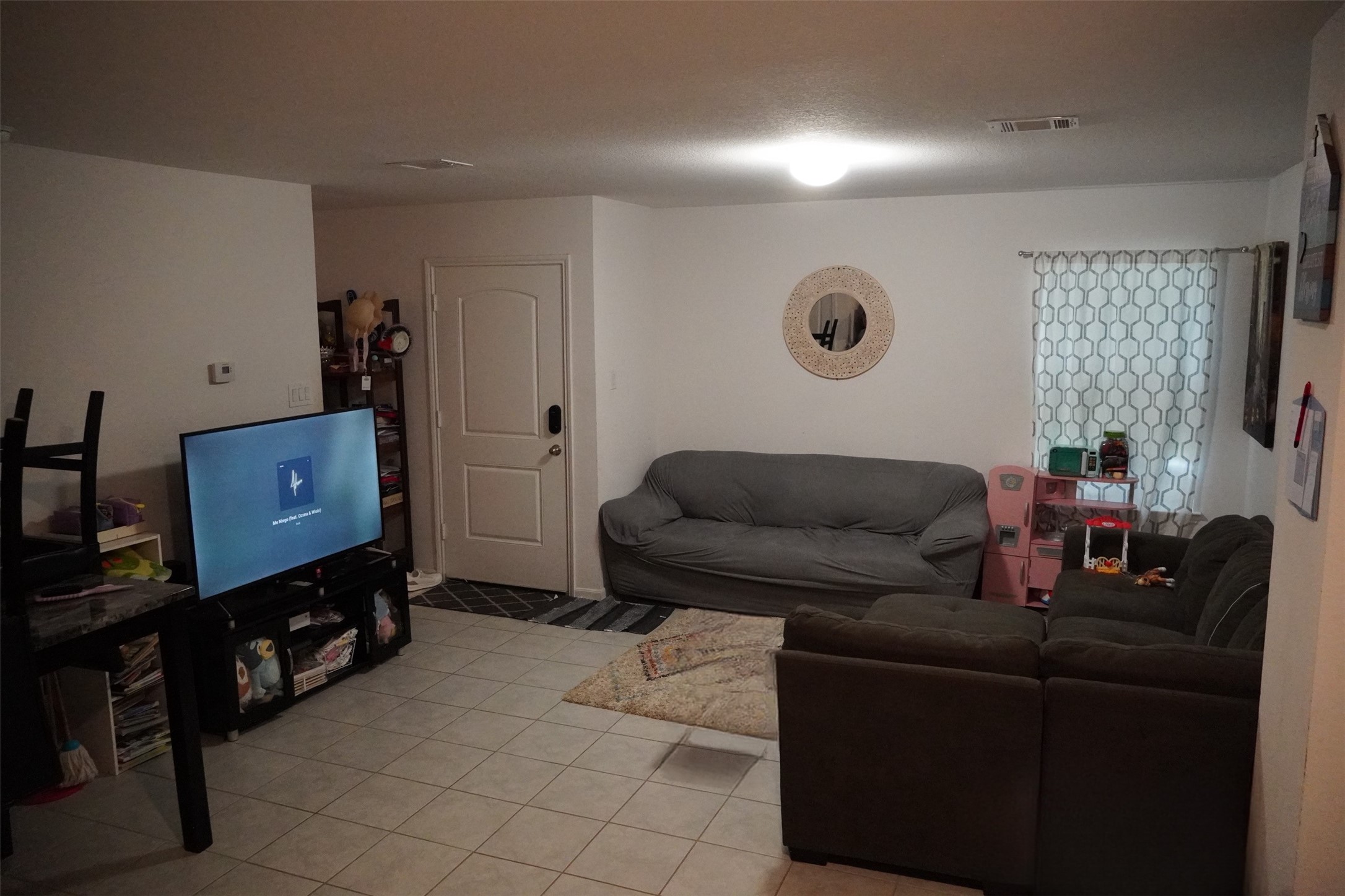 28612 Rantoul Court Point Blank, TX 77364 - Photo 2 of 4 a living room with furniture and a flat screen tv