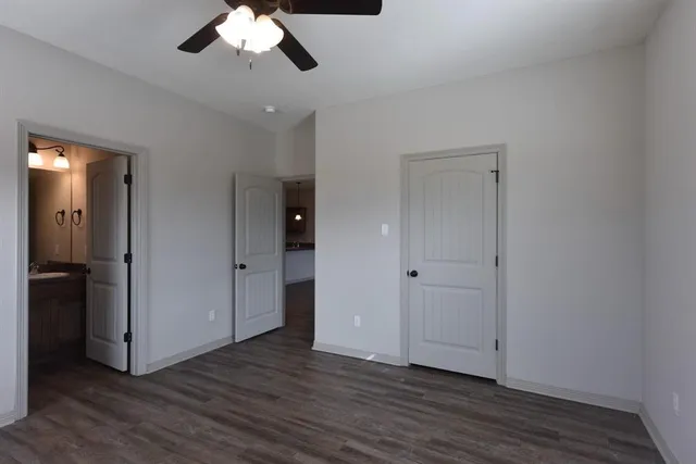 a kitchen with kitchen island a stove a sink a center island a refrigerator and a counter top