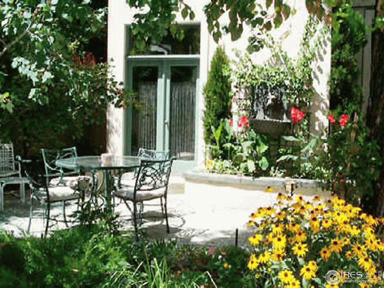610 Vine Street Denver, CO 80206 - Photo 2 of 5 a view of a chair and table in backyard of the house