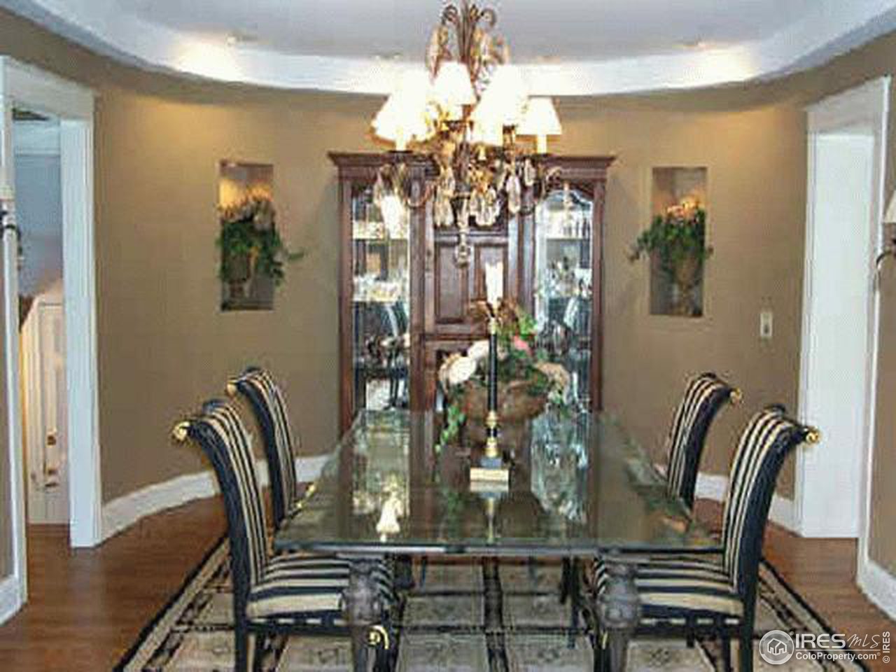 610 Vine Street Denver, CO 80206 - Photo 4 of 5 a view of a dining room with furniture and chandelier