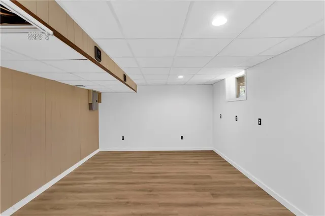 a view of room with wooden floor